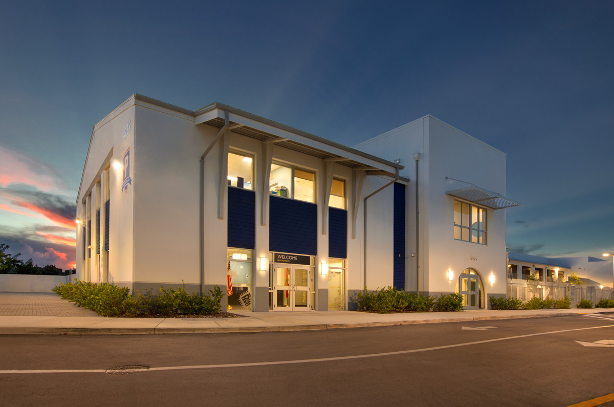 Architectural dusk view of the Pinecrest prep charter k-12 school in Miami.